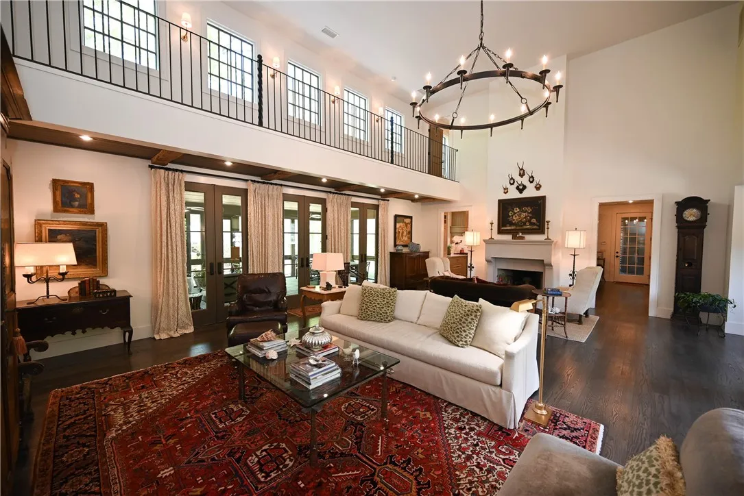 The long indoor balcony overlooks the main living room.