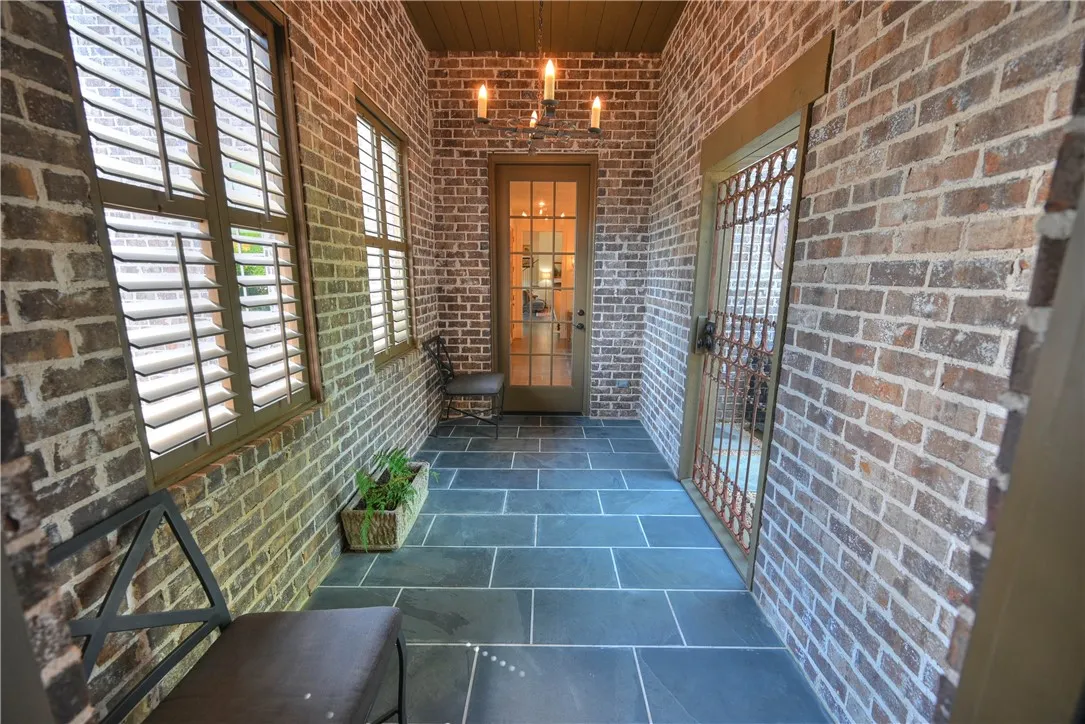 Connected to the kitchen area is an enclosed walkway leading outside and to the garage!