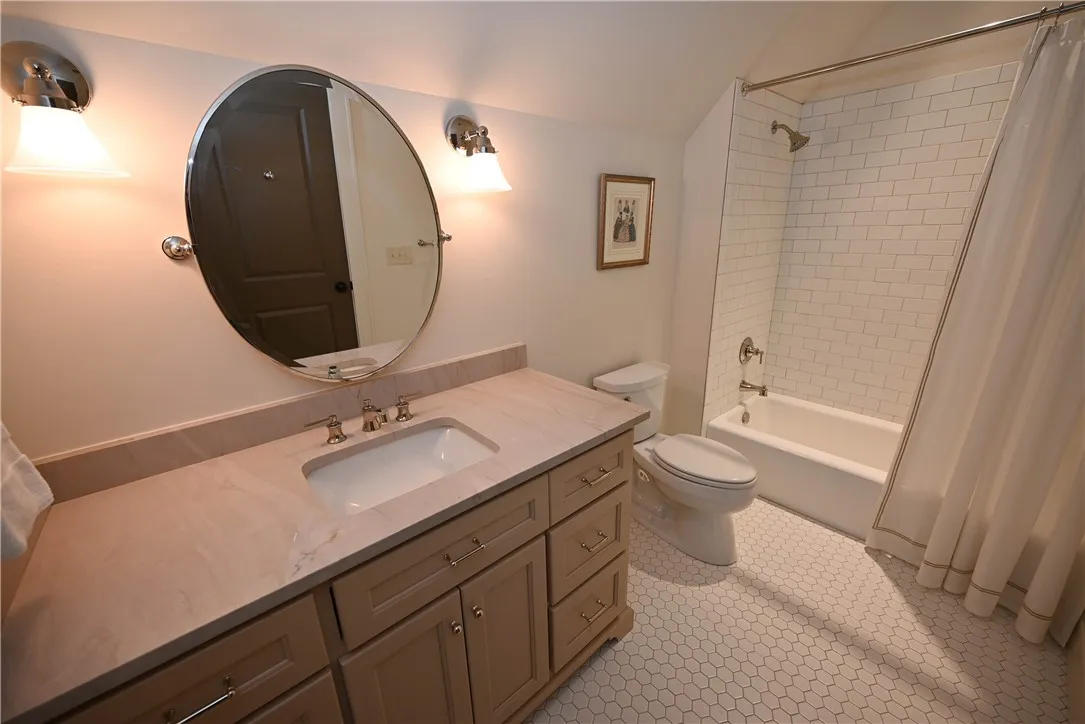 Bedroom 2's en-suite bathroom, lots of storage!