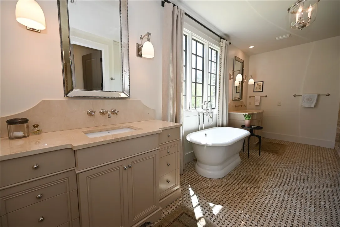 Private and luxurious master bathroom with double vanities, and a garden tub.