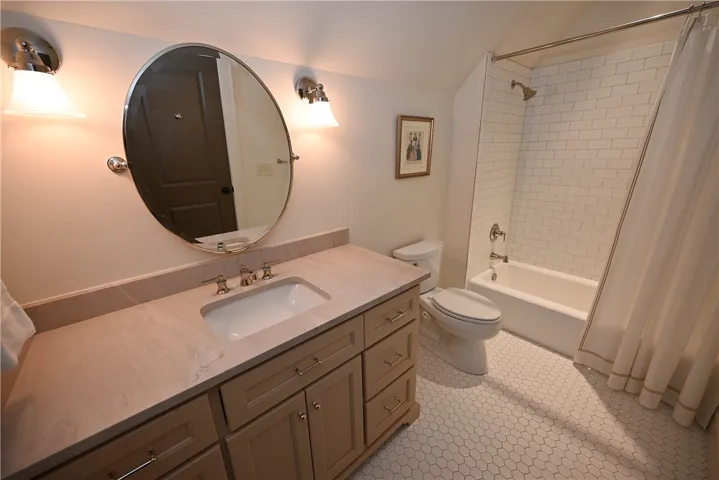 Bedroom 2's en-suite bathroom, lots of storage!