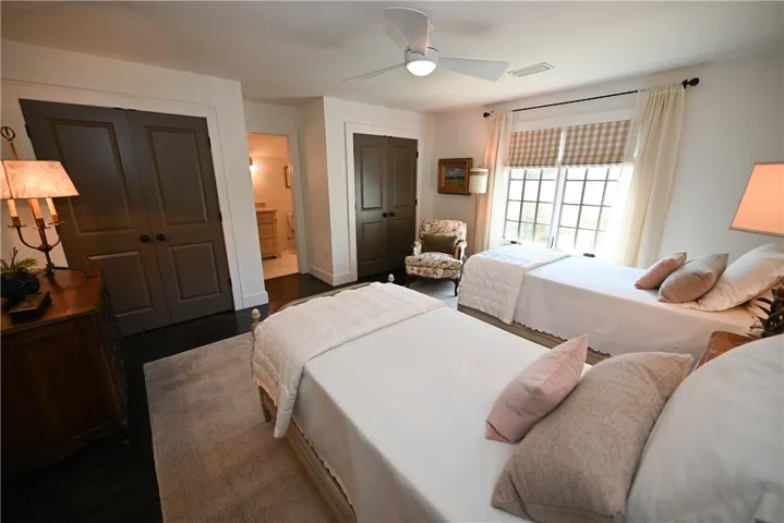 Completed with a window seat, and double closets with structed shelving.