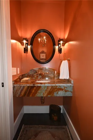 Powder room located on the main floor with an Apache quartzite counter.