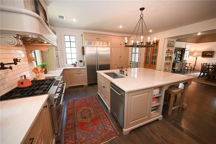 With professional grade stainless steel appliances, pot filler, and gas cooktop, this kitchen was made with those who love to cook in mind!