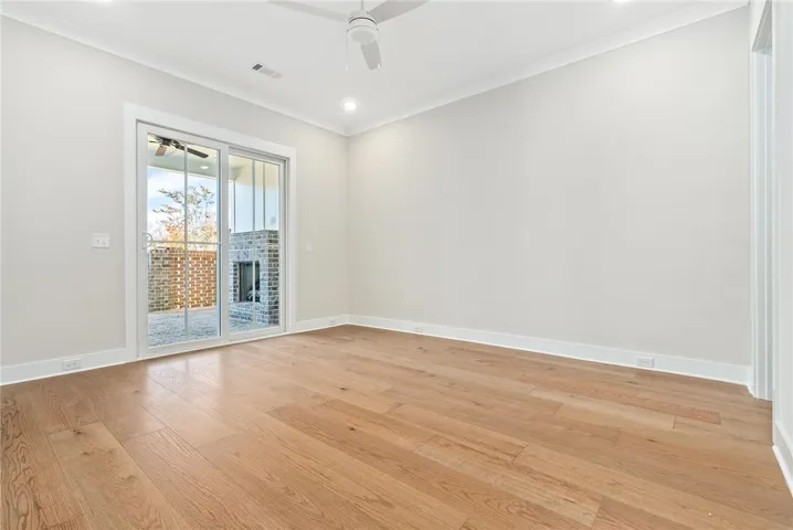 PRIMARY BEDROOM MAIN LEVEL WITH PRIVATE COURTYARD ACCESS