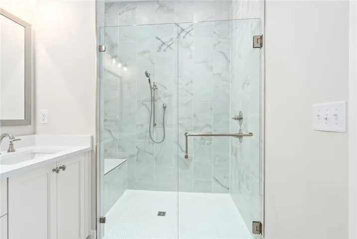 PRIMARY BATH WITH ZERO ENTRY SHOWER & AWARD WINNING BELL CABINETRY
