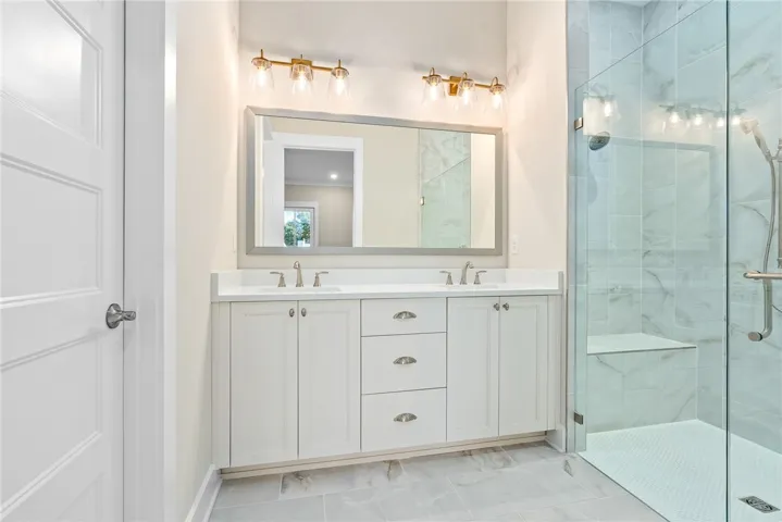 PRIMARY BATH WITH ZERO ENTRY SHOWER & AWARD WINNING BELL CABINETRY