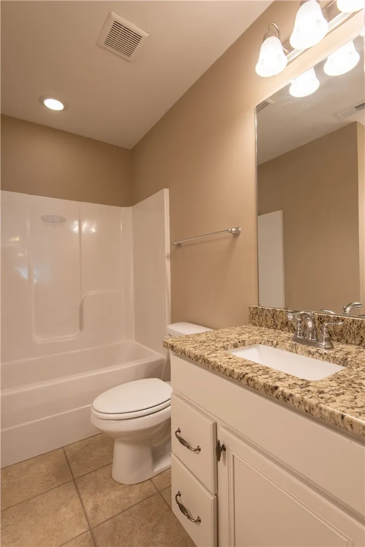 Guest bath with granite c-tops (prior to tenants moving in)