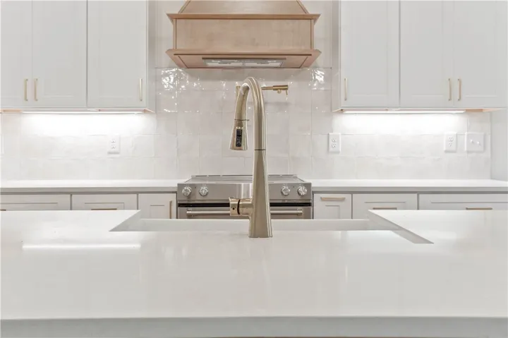 Farm style Clay Sink - under cabinet lighting - Pot filler!