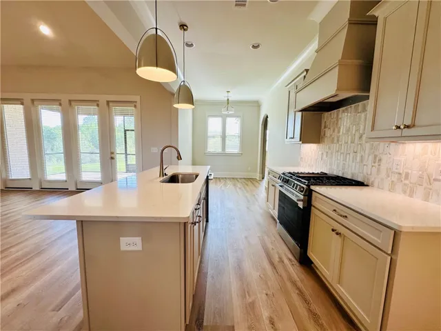 This bright kitchen with modern fixtures provides a spacious and inviting atmosphere.