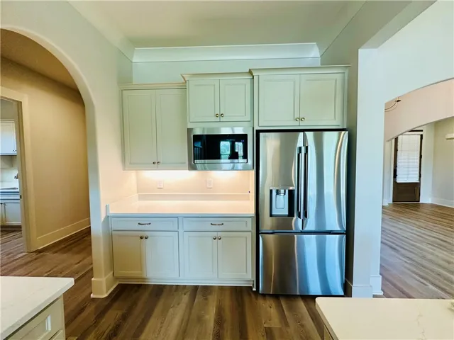 This thoughtfully designed kitchen area provides ample storage and modern appliances.