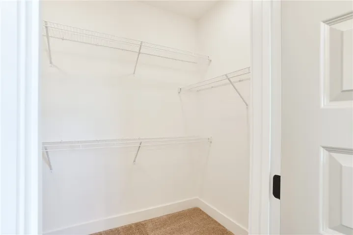 EXAMPLE of a Toby B - Primary Bedroom Walk-in Closet.  All plans, pricing, & specifications are subject to change without notice.