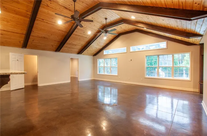great room with doors to flex space/office and half bath