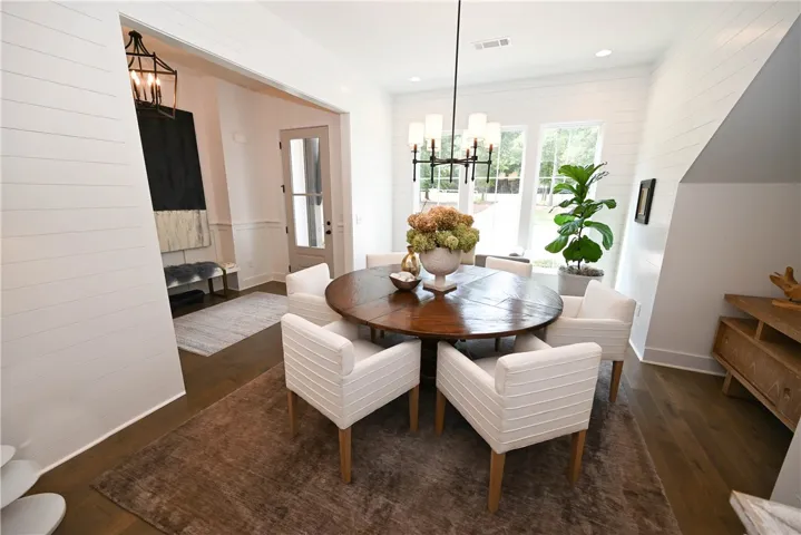 Formal dining with foyer in background.