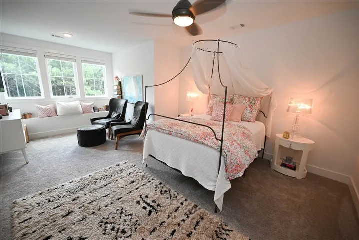 Upstairs bedroom #3: also extremely spacious with beautiful views! Seating area with window bench. XL walk-in closet with dressing area.