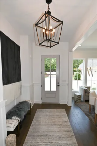 Inviting foyer with formal dining to the left.