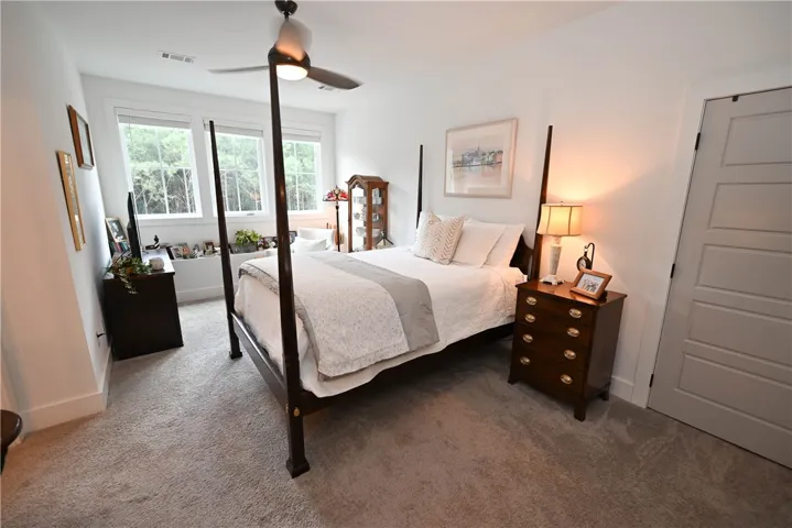Upstairs bedroom #1: large suite with seating area, walk-in closet, & private bath.