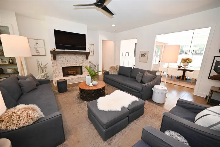 Great room with foyer & dining in background.