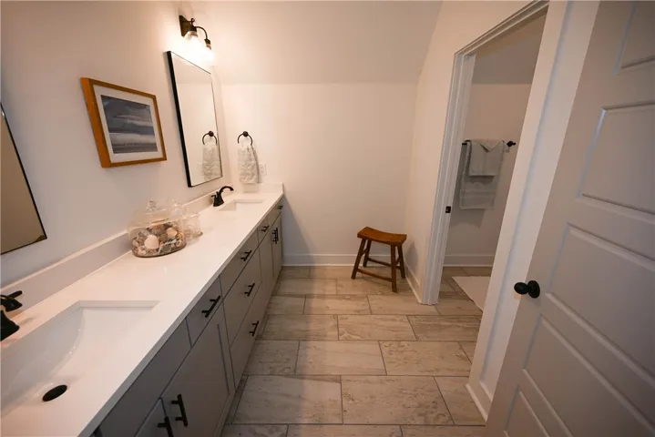Shared bath for upstairs bedrooms 2-4. Includes a separate dressing area with double sinks & lots of storage!
