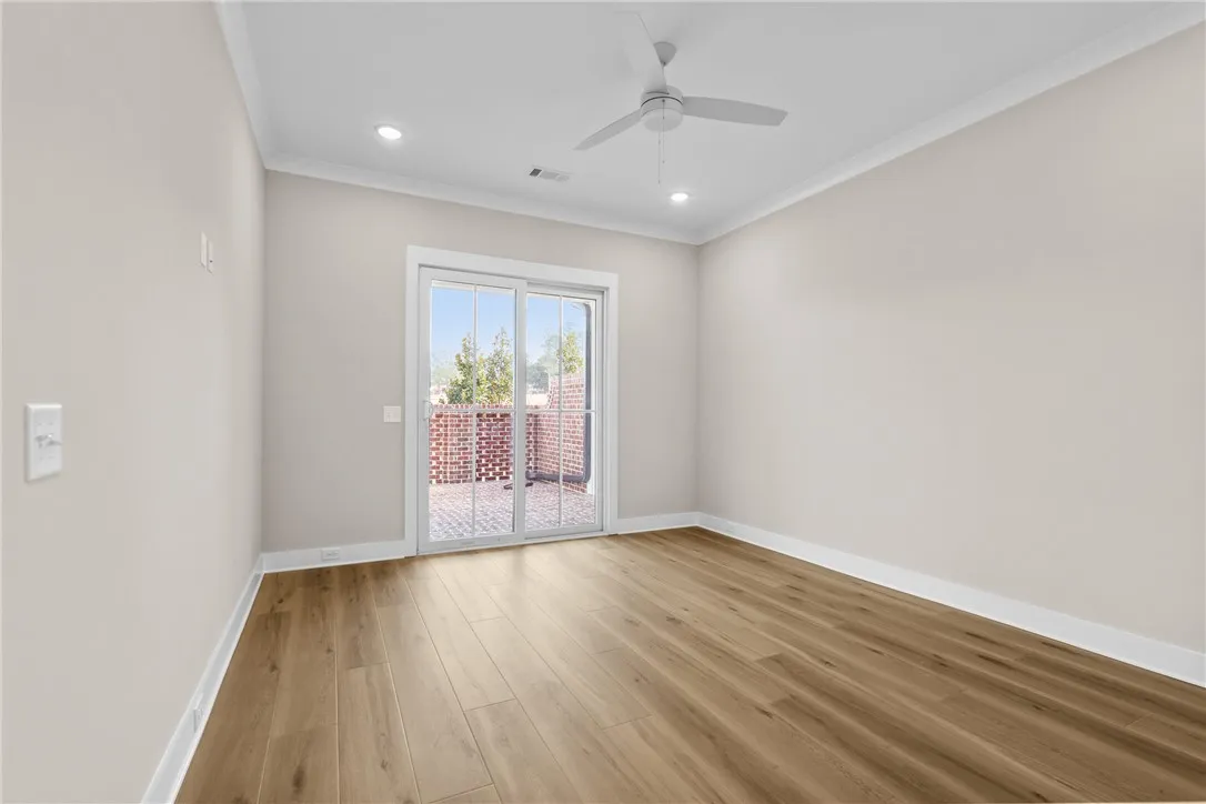 This versatile room features durable flooring and direct access to an outdoor space.