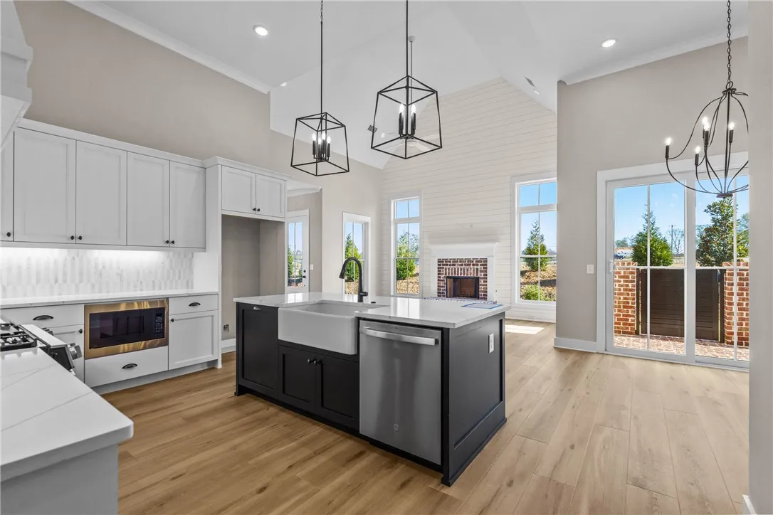 This spacious kitchen offers an open layout, ideal for both daily living and entertaining.