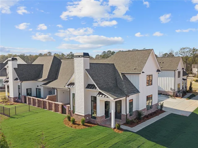This charming home features a classic design with modern touches and a welcoming front entrance.
