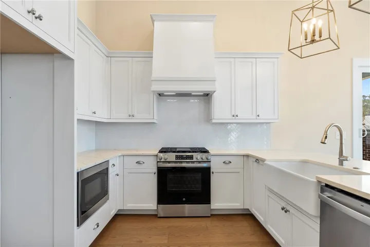 This bright kitchen features ample counter space and modern appliances, perfect for everyday living.