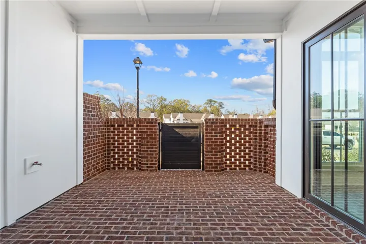 This private brick patio offers a serene outdoor retreat, perfect for relaxation or entertaining.