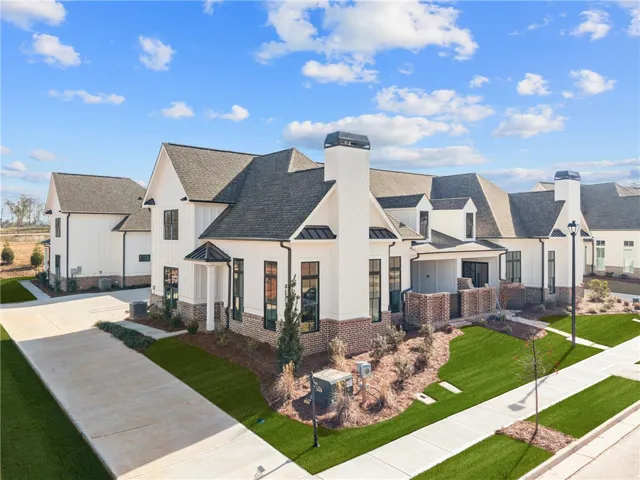 This newly constructed residence showcases a contemporary architectural design with pristine finishes.