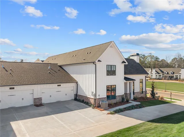 This newly constructed home boasts a charming exterior with a classic, inviting appeal.