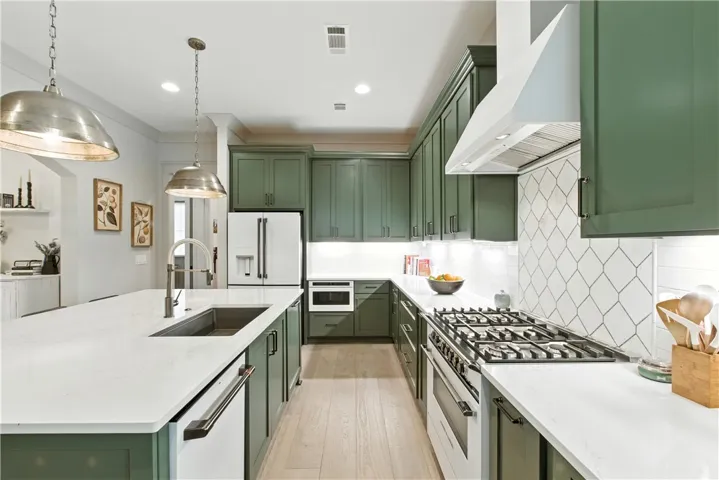 This kitchen is a haven of quiet sophistication. The Cafe appliances are matte white enamel with black satin handles. This kitchen speaks volumes without saying a word.