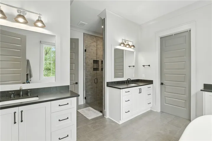 Water Closet door can be found beyond the shower