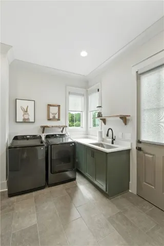 Laundry room with washer and dryer that will convey