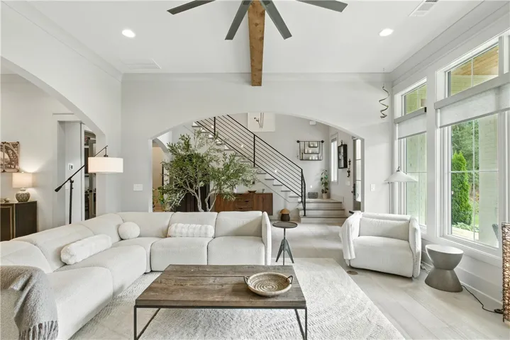 10 ft ceilings with wide Cove molding trim has a stunning appearance as the ceilings walls and trim are all painted the same designer color. This looks like a page out of a Restoration Hardware Magazine.