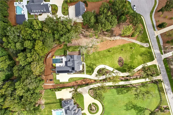 over 200 feet of road frontage and nearly 700 feet deep, this parcel is large and manicured to perfection