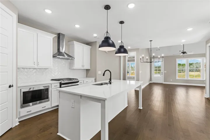 This bright kitchen with a large island offers seamless open-concept living.