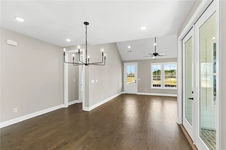 This airy interior boasts gleaming wood flooring and generous natural light, creating an inviting atmosphere.