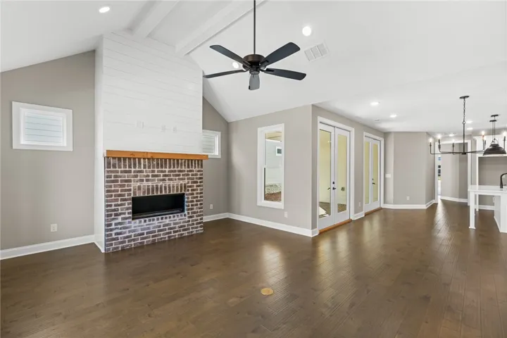 This living space features hardwood floors and a fireplace, creating a warm and inviting atmosphere.