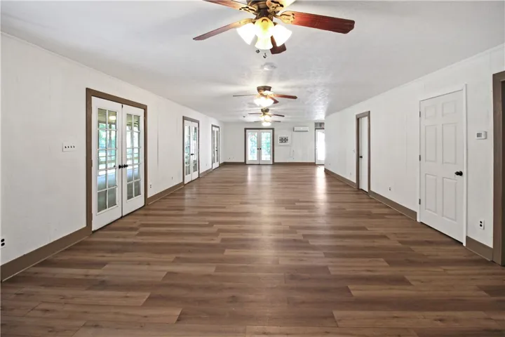 Giant Living Room Lined with French Doors