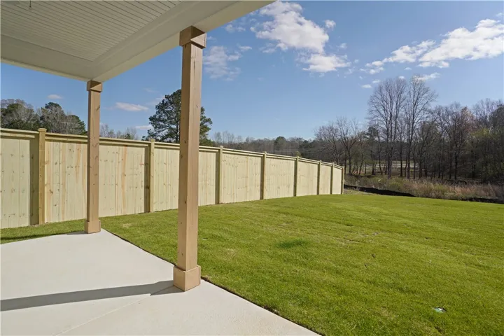 Covered Back Patio & View of Backyard