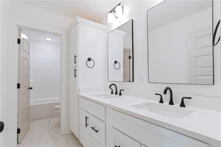Hall Full Bathroom with Floor To Ceiling Cabinet for Linen Storage