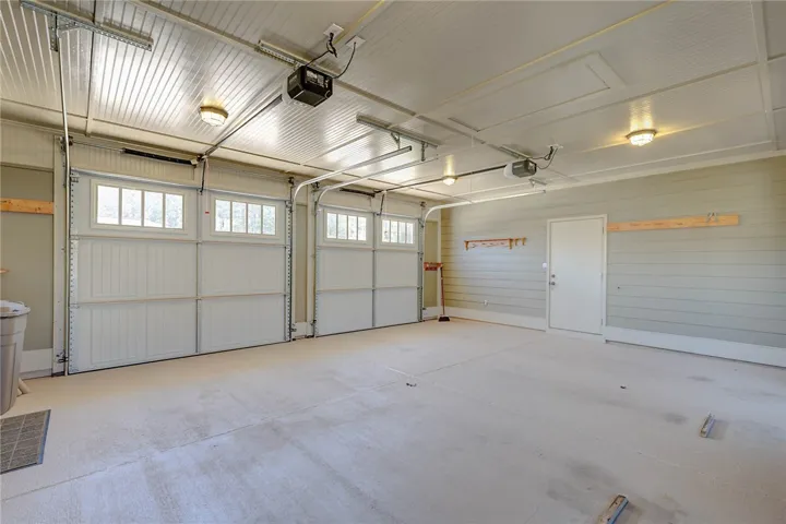2 car garage with door into storage or workshop