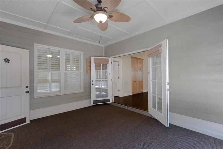 Sunroom with French doors to the living space