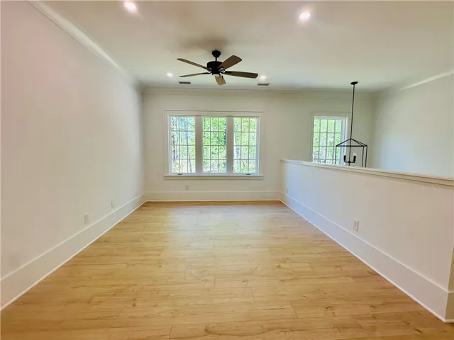 This spacious interior features abundant natural light, offering a versatile living area.