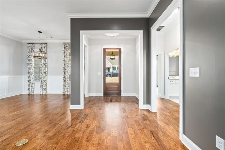 welcoming bright entry with genuine sanded wood floors