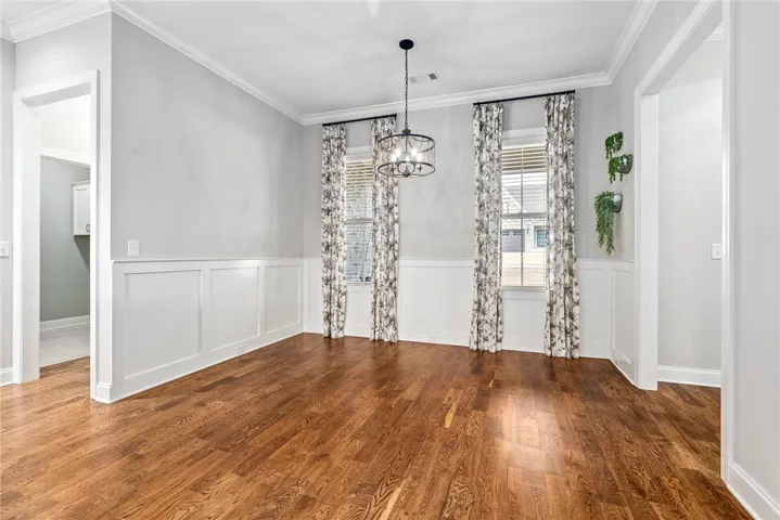 Charming dining area with genuine sanded wood floors