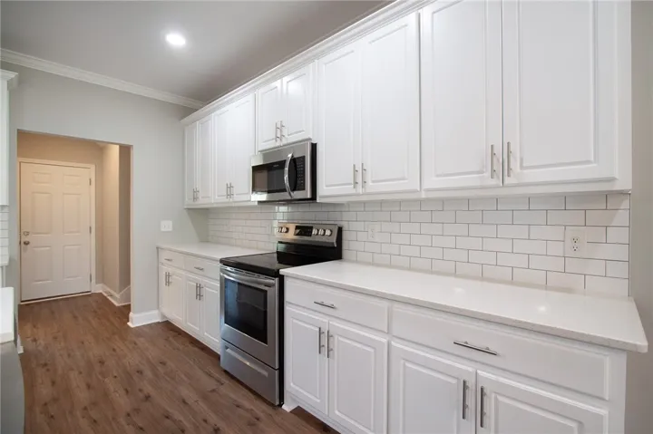 Kitchen is located near garage entrance