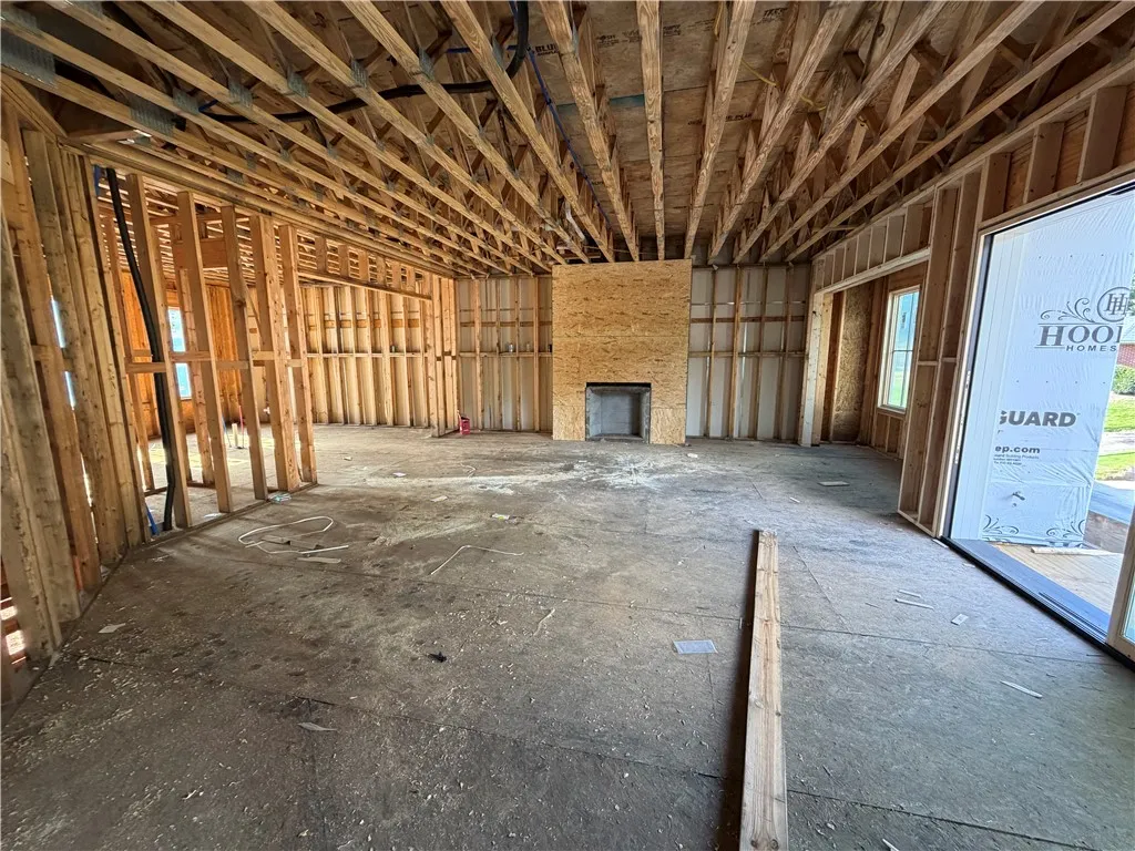 A promising foundation, this interior framing sets the stage for a grand design with a future fireplace.