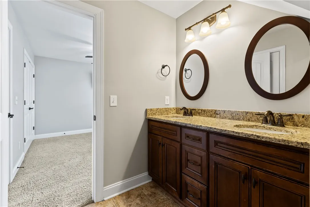 2nd floor bathroom with double mirrors and sinks