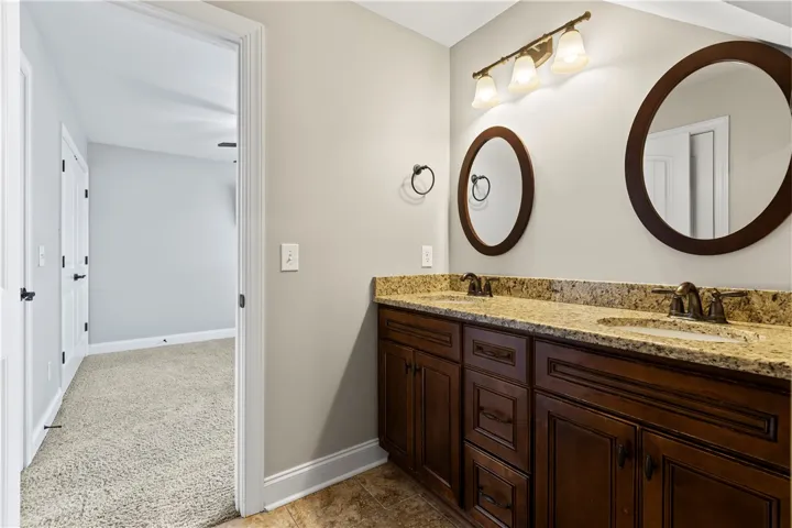 2nd floor bathroom with double mirrors and sinks